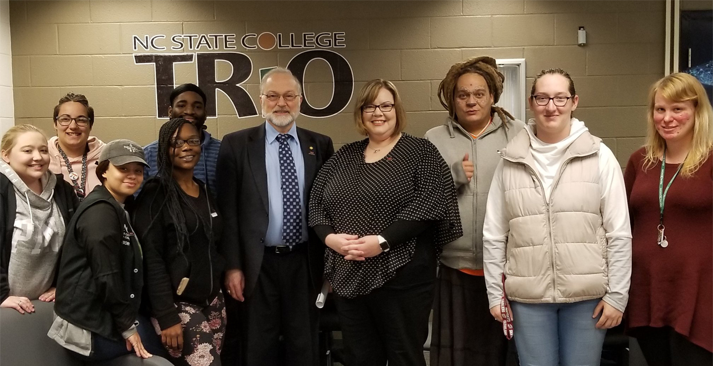 nine Trio students pose with NCSC president