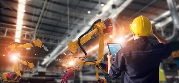 engineer working with tablet and robotic technology