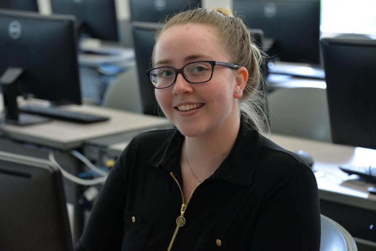 Alyvia Erow sits at a computer in a lab in the Kehoe Center.