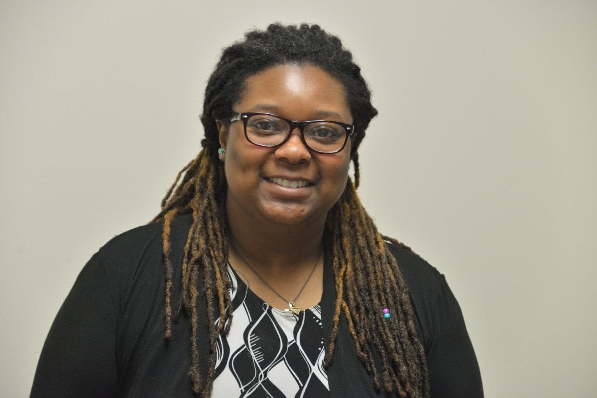 Cedria Howell poses in the hall of the Kehoe Center in Shelby.