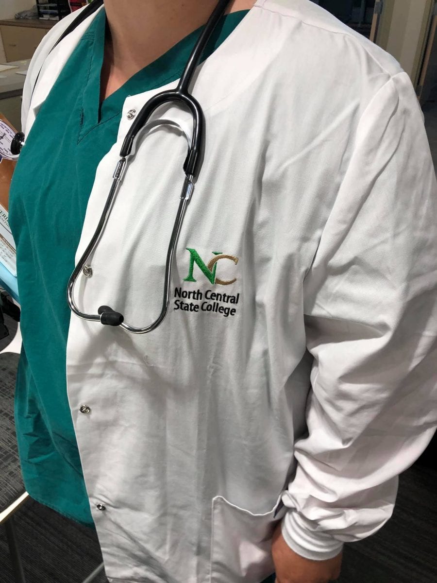 lab coat with nc state logo and stethoscope