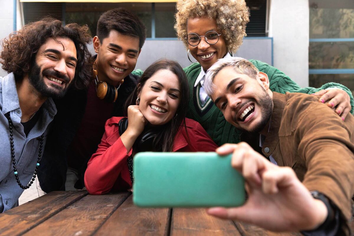 Smiling group of friends taking a selfie.