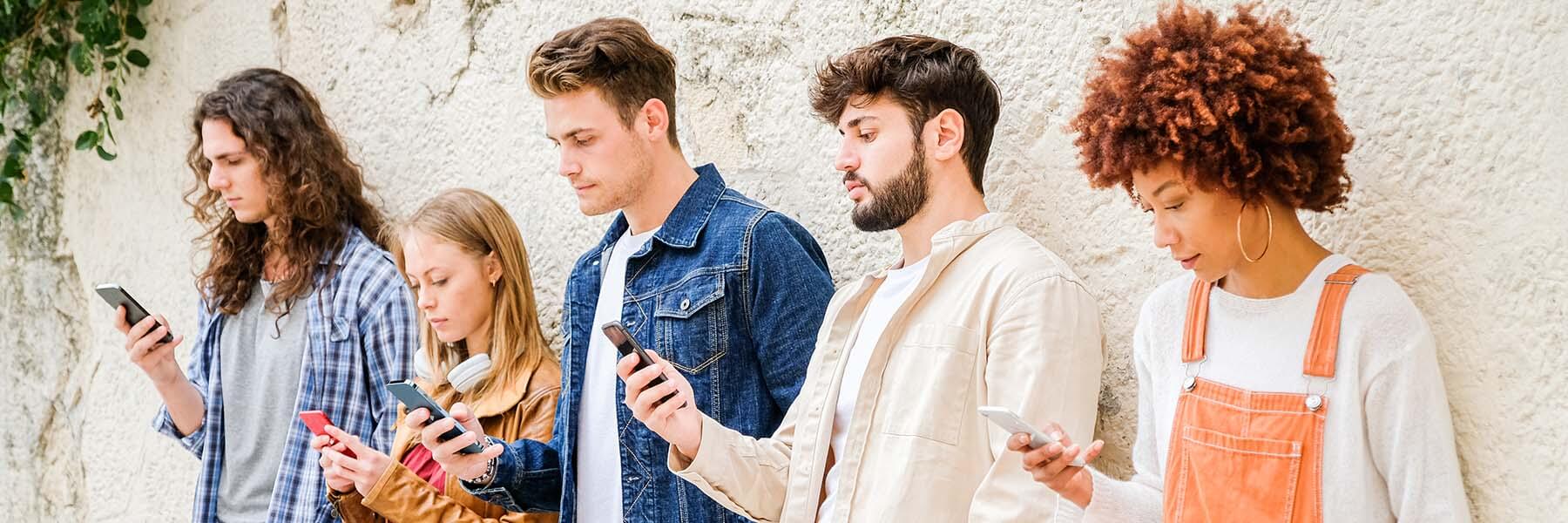 Group of people looking at their phones