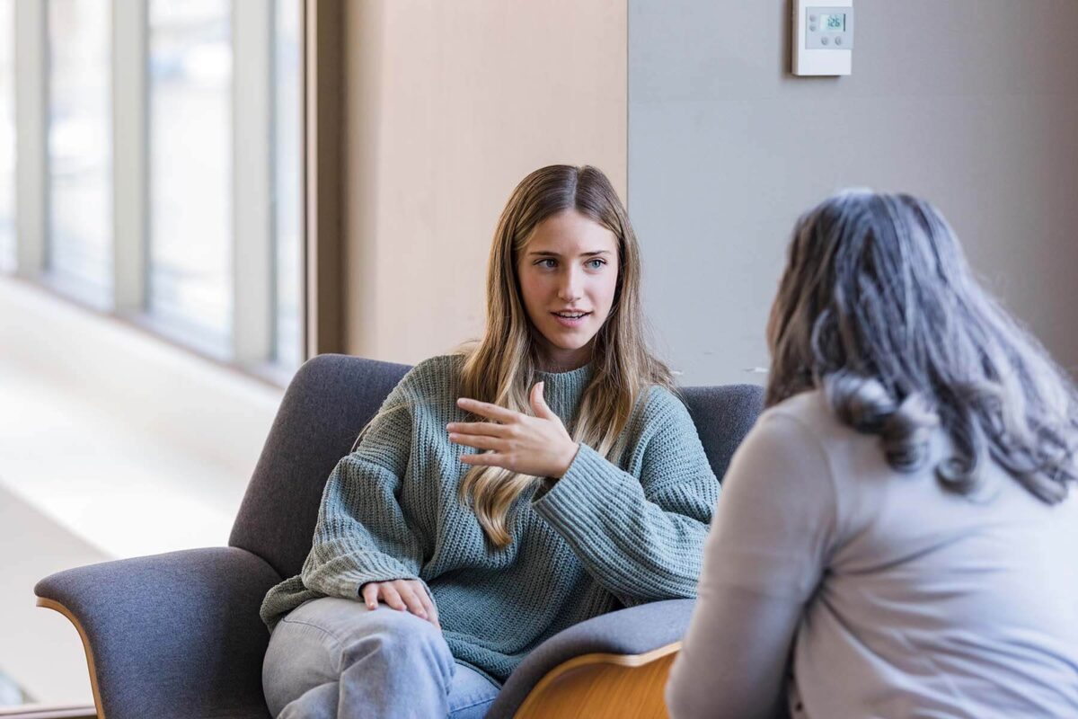 Young woman talking to a counselor
