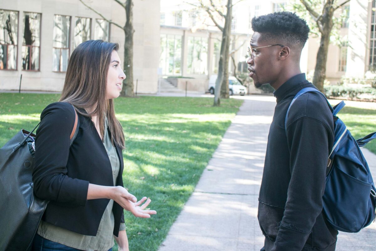 Two students talking outside