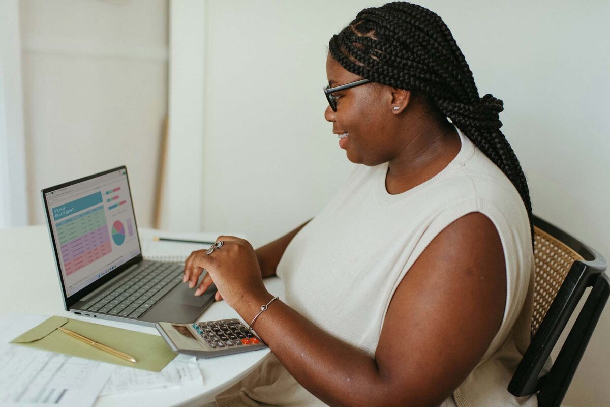 Woman at laptop working on her budget