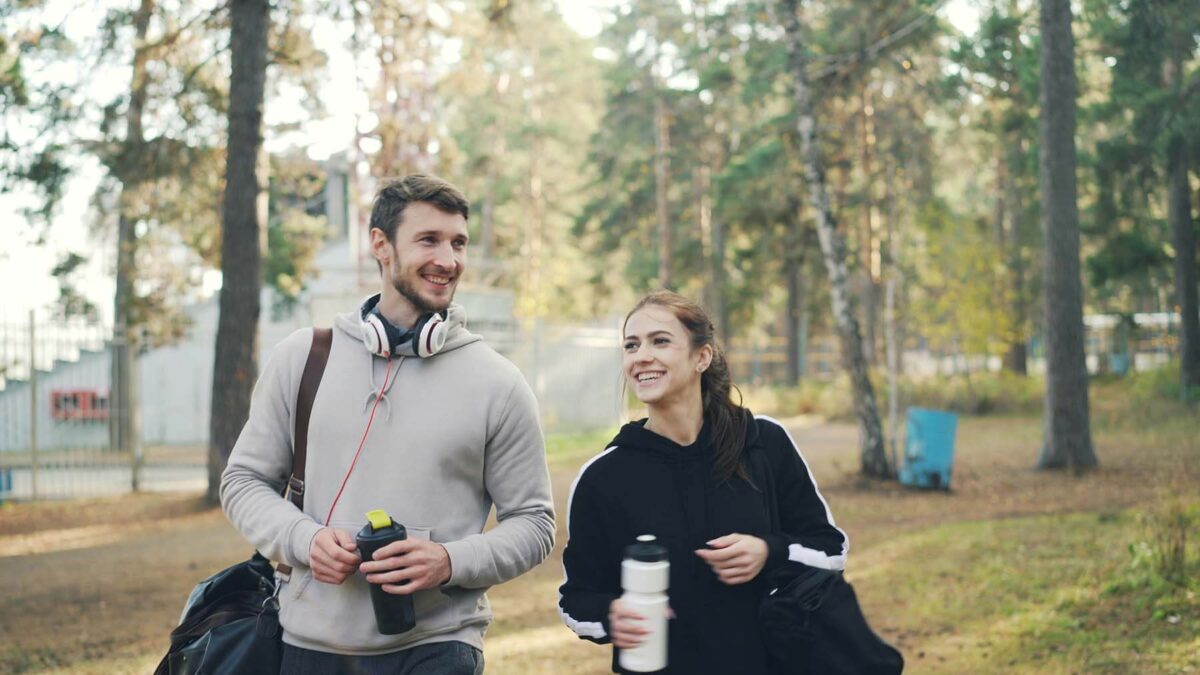 Man and woman walking outdoors
